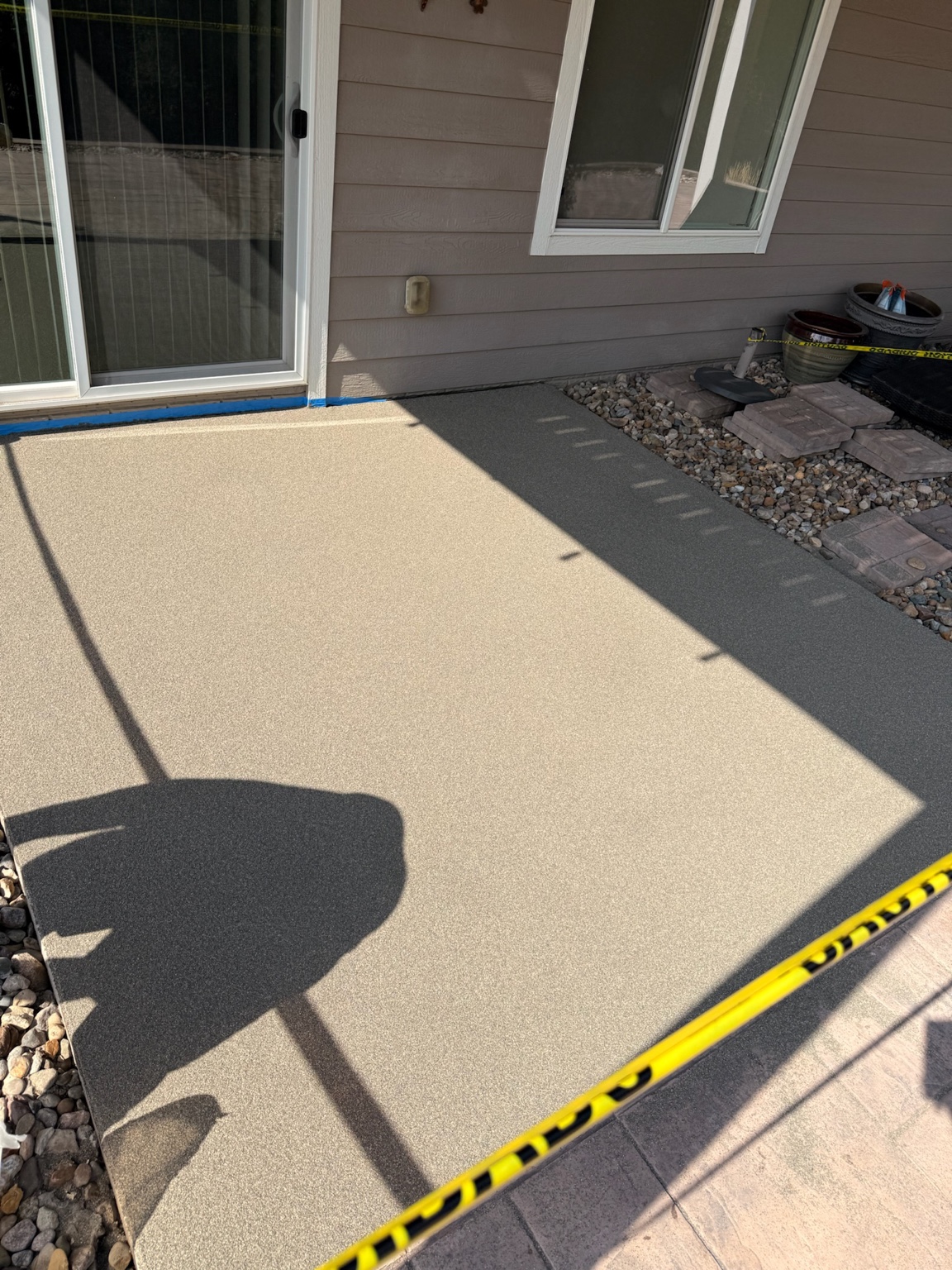 Resurfaced textured concrete patio outside a Waterloo home