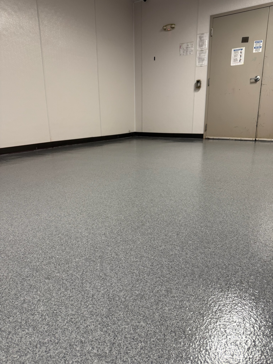 Finished gray epoxy floor coating in an Iowa commercial room
