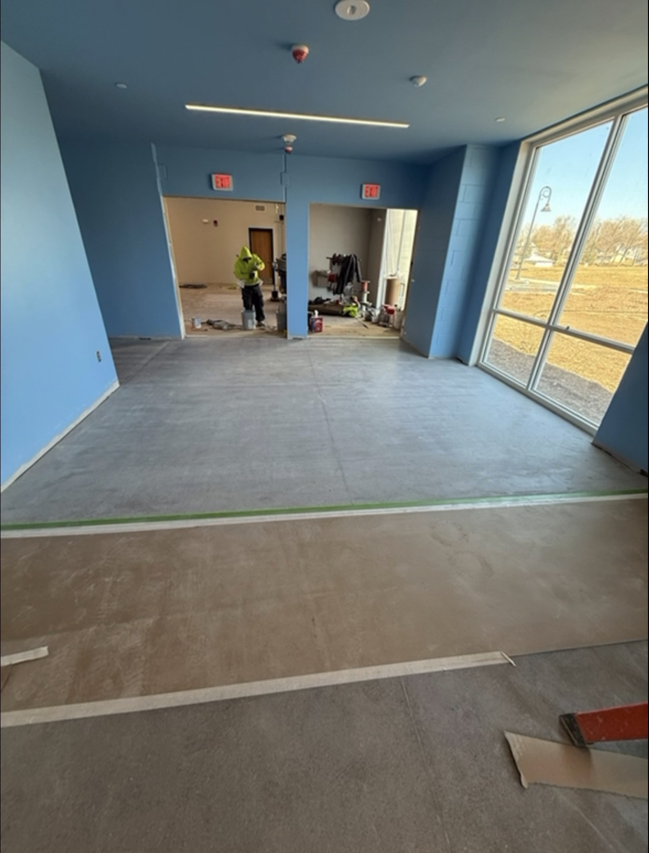Bare concrete floor prepared for epoxy coating in a Waterloo, Iowa commercial building