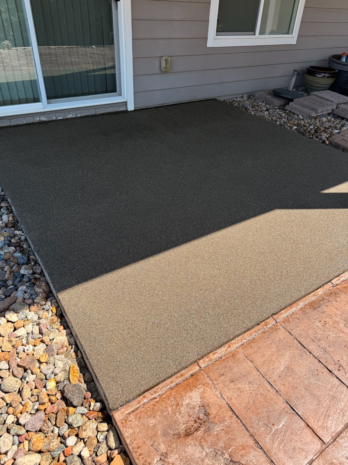 Finished textured concrete coating on a backyard patio in Waterloo